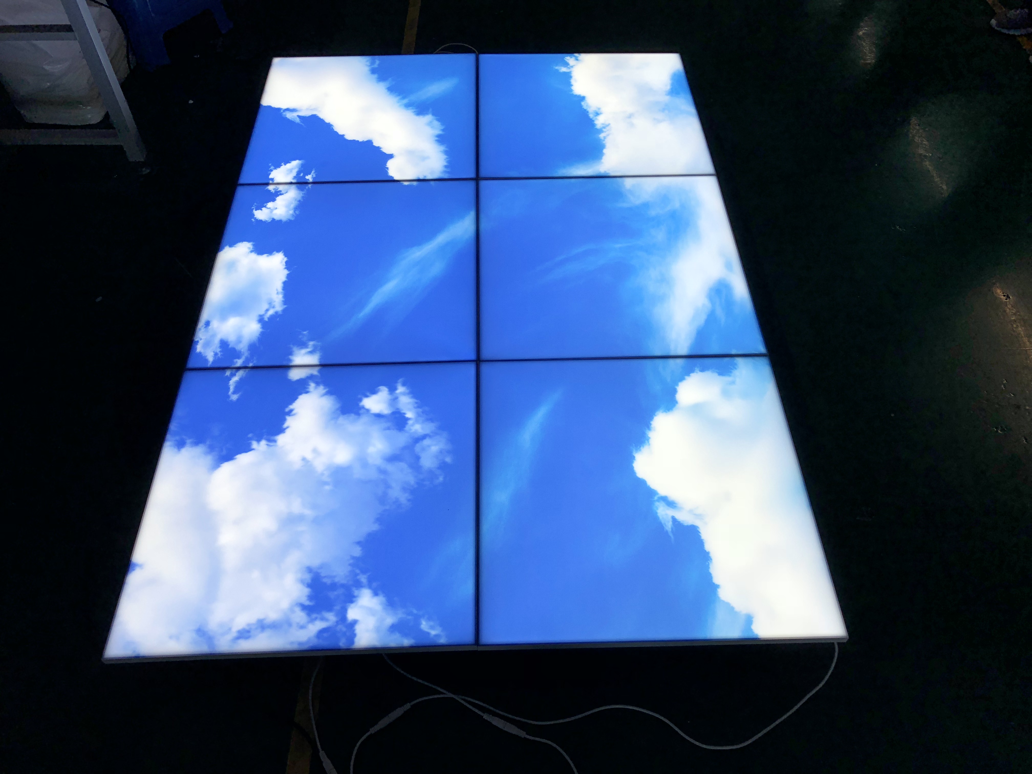 Spliced frameless blue sky light panel with cloud pattern – Lumin biophilic LED ceiling installation example