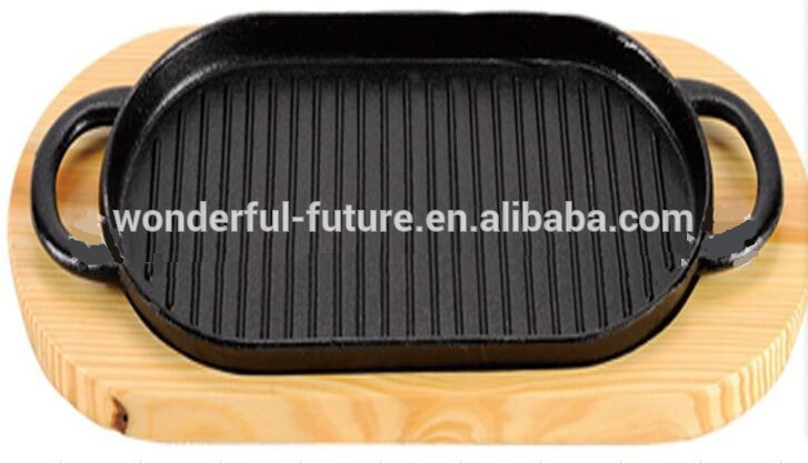 Sizzler plate with wooden base.jpg