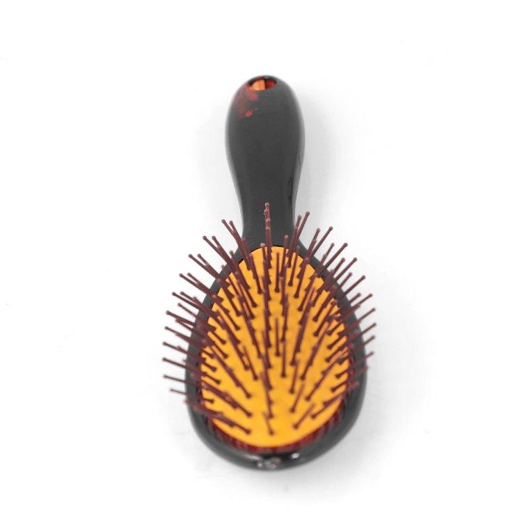 Xinlinda brand unique design oval shape amber air cushion massage hair brush personalized comb
