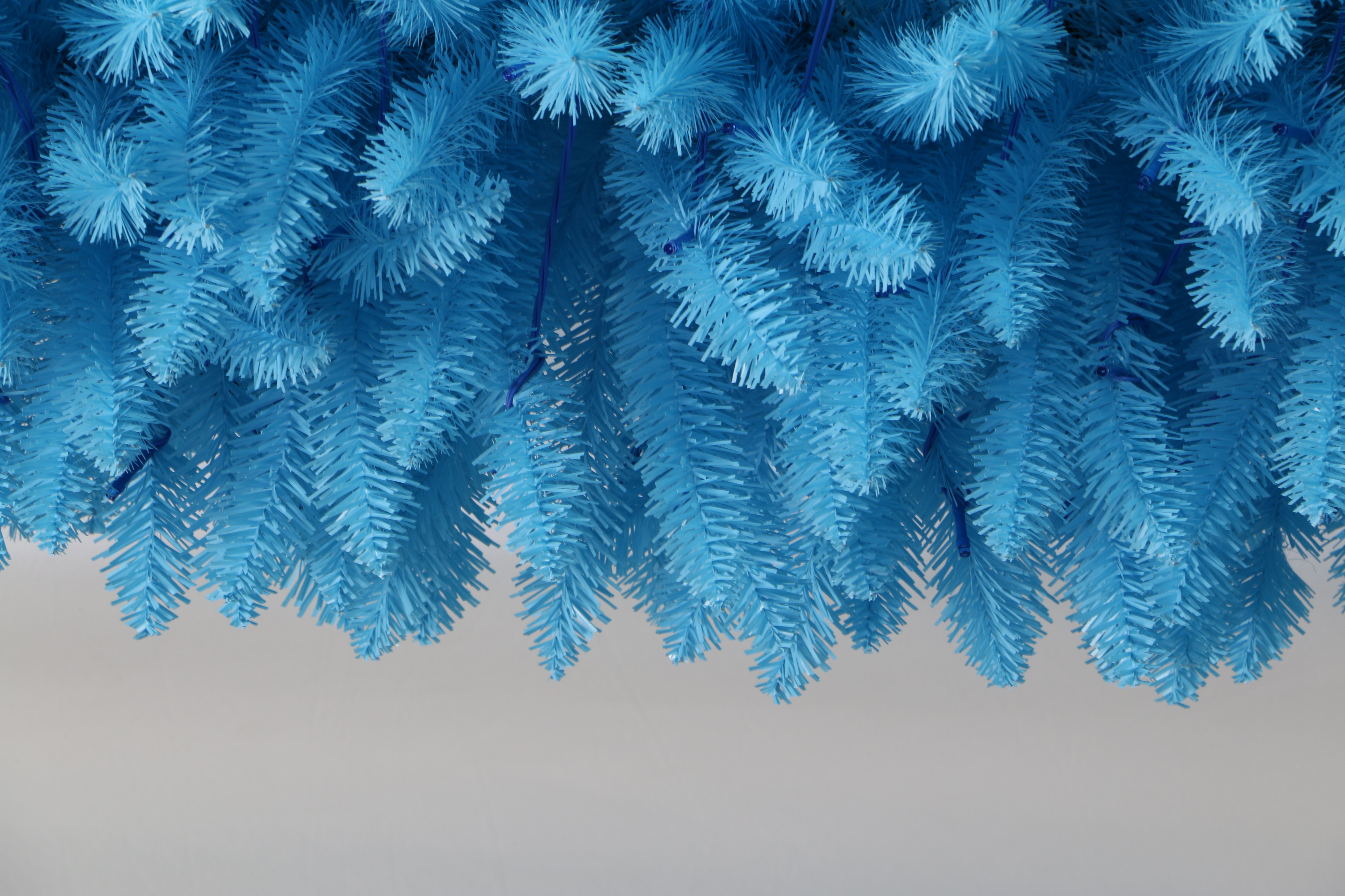 Elevate your holiday decor with the Trendy Tree 210cm Pre-lit Blue Pencil Christmas Tree. This slim, space-saving artificial tree features vibrant blue LED lights, a sturdy metal stand, and lush PVC needles. Perfect for home, office, and party Christmas displays.