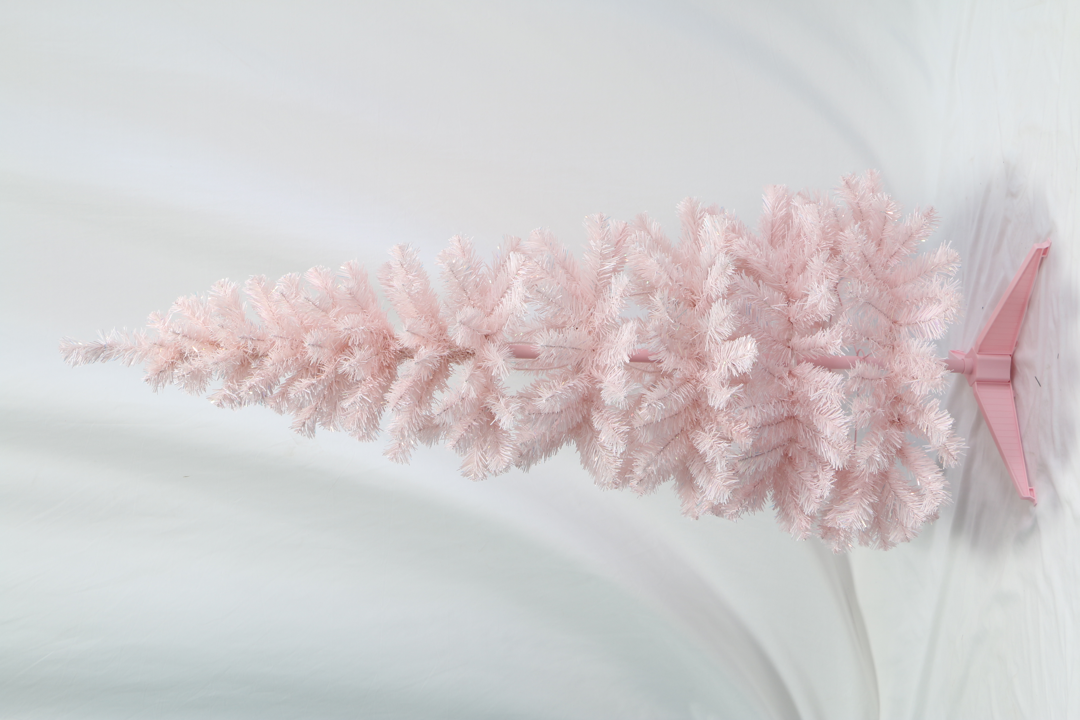 Pastel Pink Artificial Christmas Tree: Fluffy, Full-Branched Xmas Tree with Sturdy Stand. Trendy Whimsical Holiday Decor for Home, Party & Retail Spaces. Easy to Assemble, Reusable Festive Decoration. Add Playful Festive Cheer to Your Winter Celebrations. Shop Stylish Pink Christmas Trees Now!