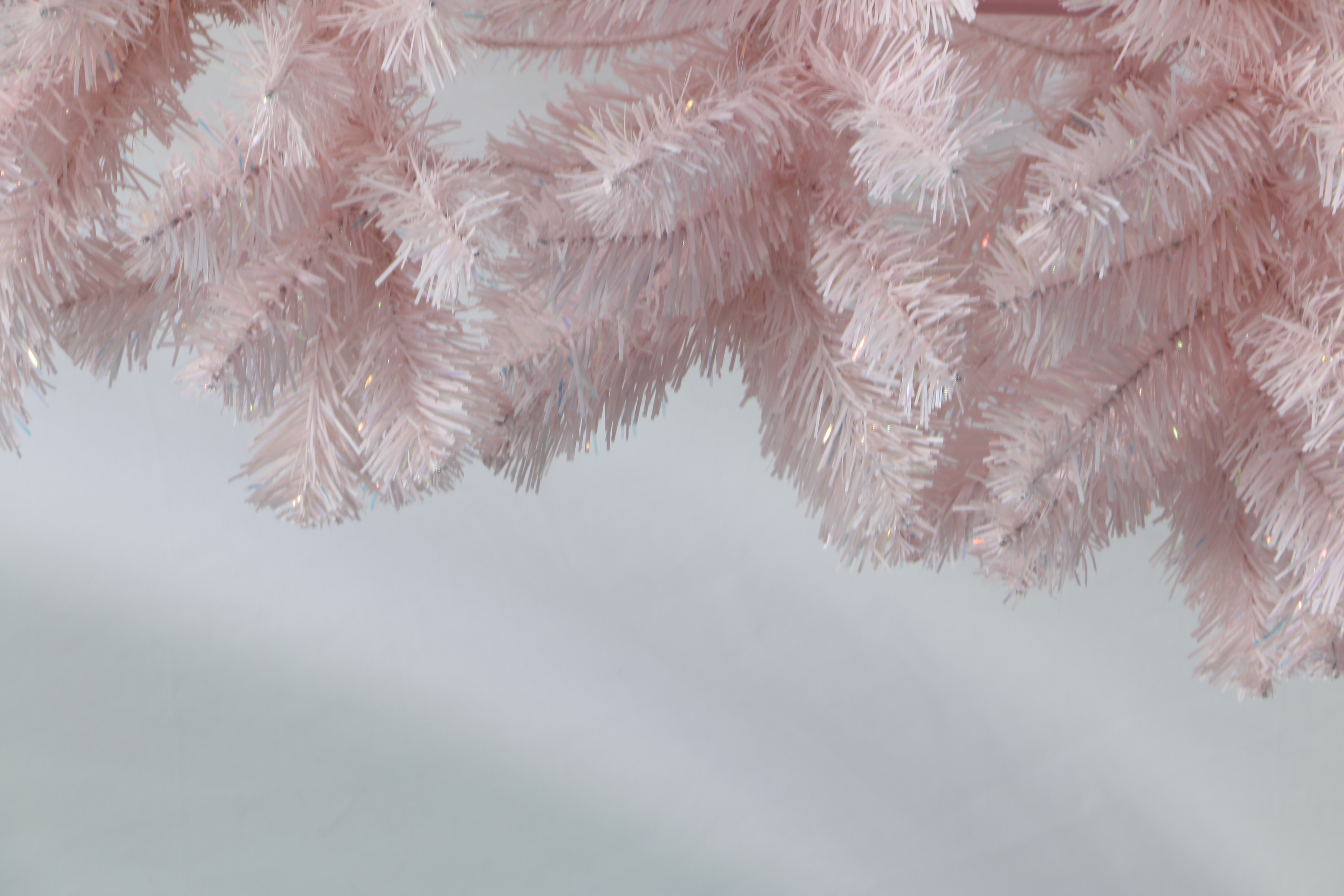 Pastel Pink Artificial Christmas Tree: Fluffy, Full-Branched Xmas Tree with Sturdy Stand. Trendy Whimsical Holiday Decor for Home, Party & Retail Spaces. Easy to Assemble, Reusable Festive Decoration. Add Playful Festive Cheer to Your Winter Celebrations. Shop Stylish Pink Christmas Trees Now!