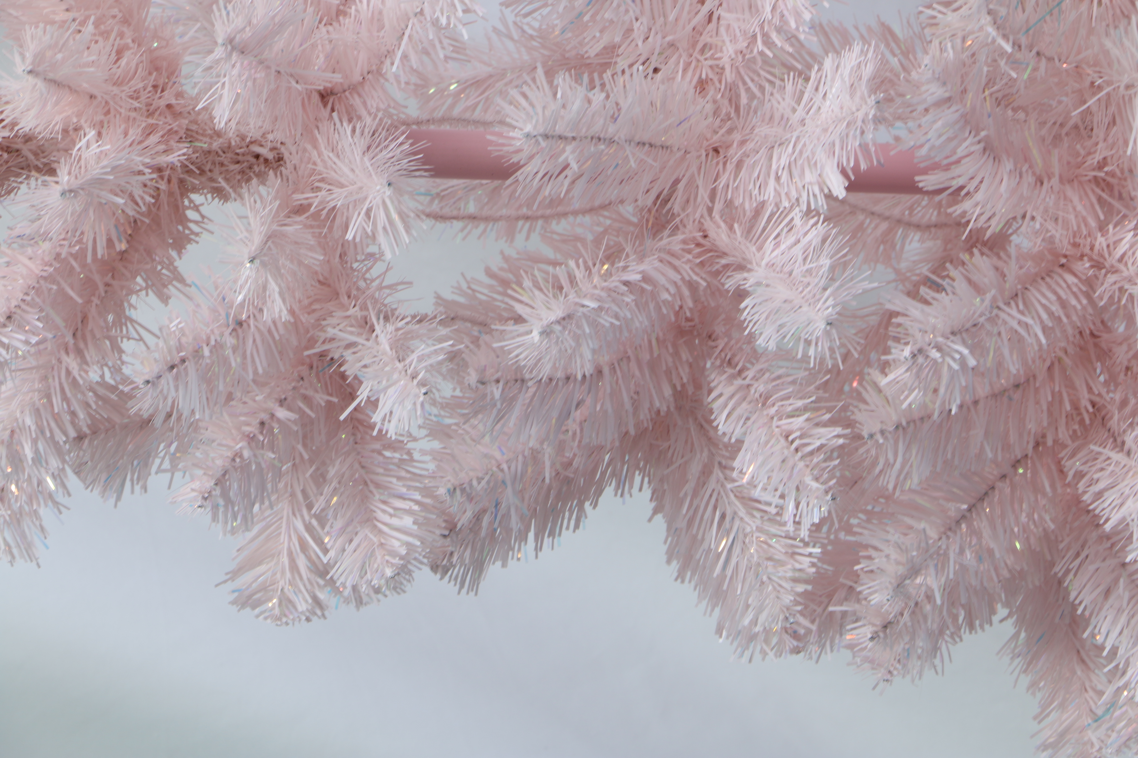 Pastel Pink Artificial Christmas Tree: Fluffy, Full-Branched Xmas Tree with Sturdy Stand. Trendy Whimsical Holiday Decor for Home, Party & Retail Spaces. Easy to Assemble, Reusable Festive Decoration. Add Playful Festive Cheer to Your Winter Celebrations. Shop Stylish Pink Christmas Trees Now!
