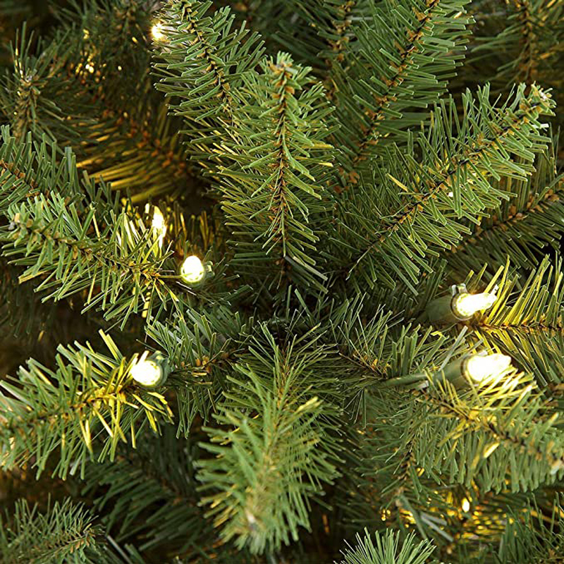 Lush PVC Branches with Warm White LED Lights. Easy assembly, sturdy metal stand, needle-free design. Ideal indoor holiday decor for cozy Christmas ambiance. Shop durable, full-bodied 210cm Christmas trees for festive home styling.