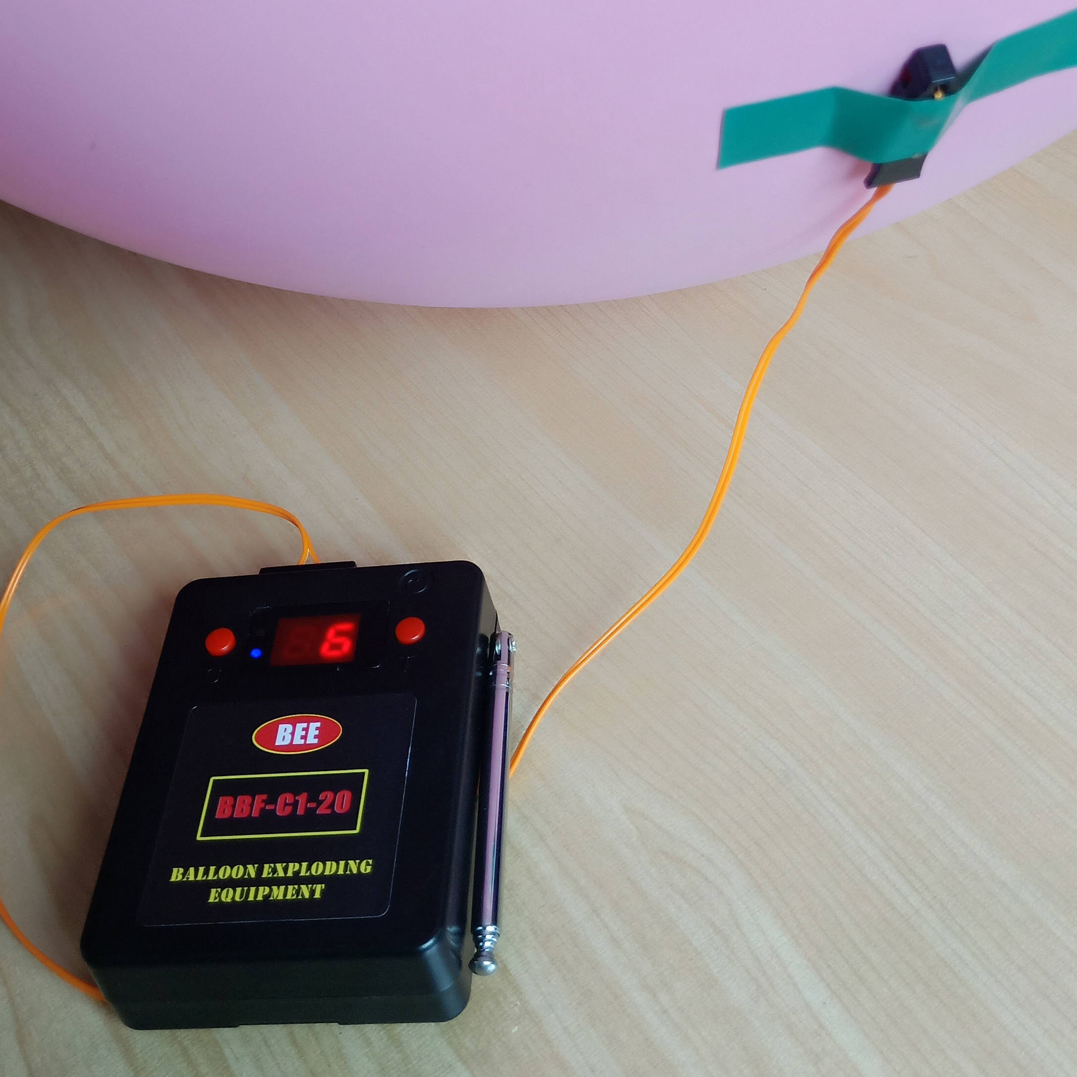 balloon firing lighting igniting exploding bursting blasting control